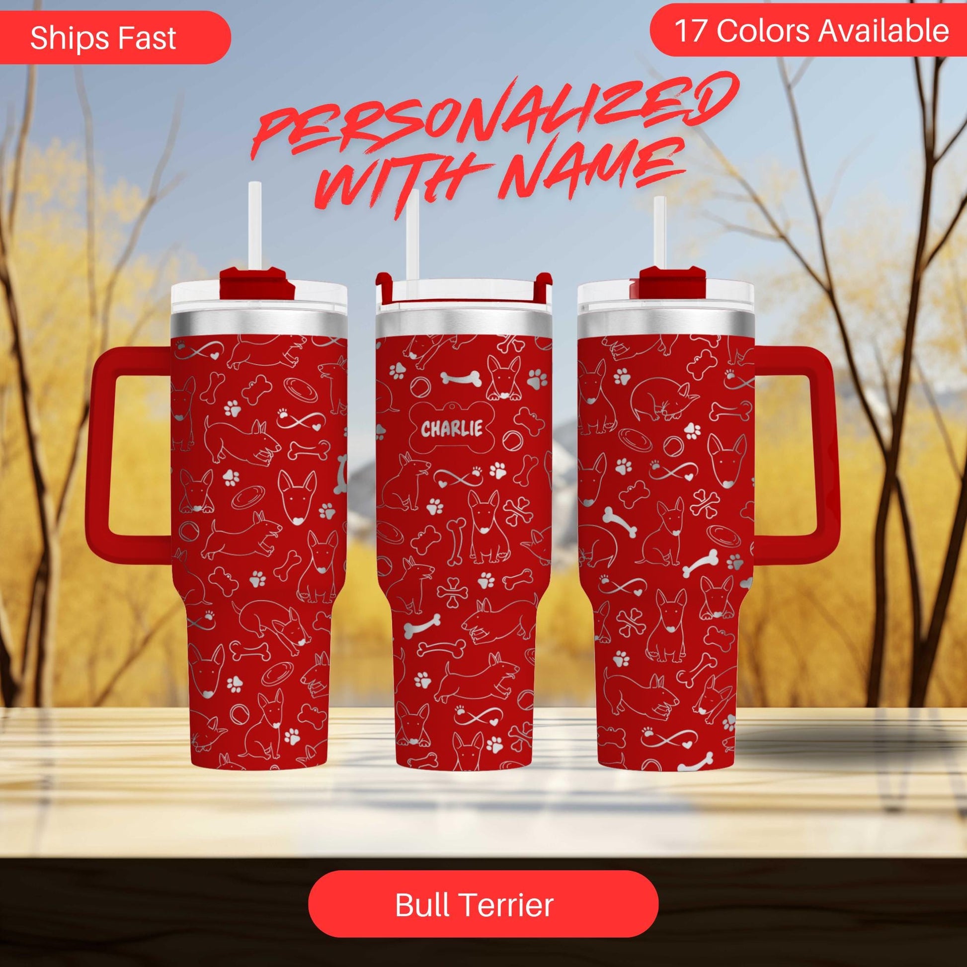 three red travel mugs sitting on top of a table