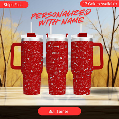 three red travel mugs sitting on top of a table