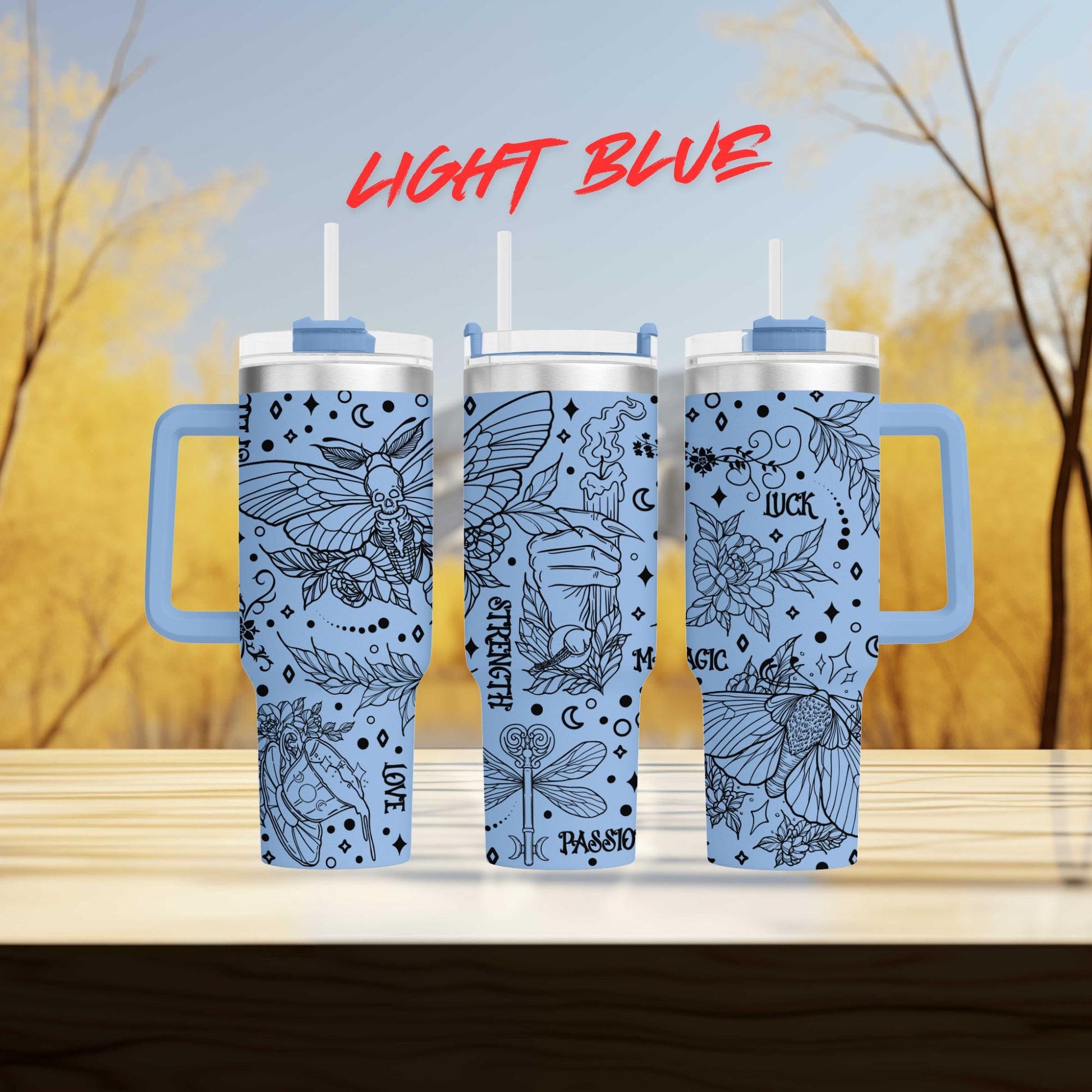 three tumblers sitting on top of a wooden table