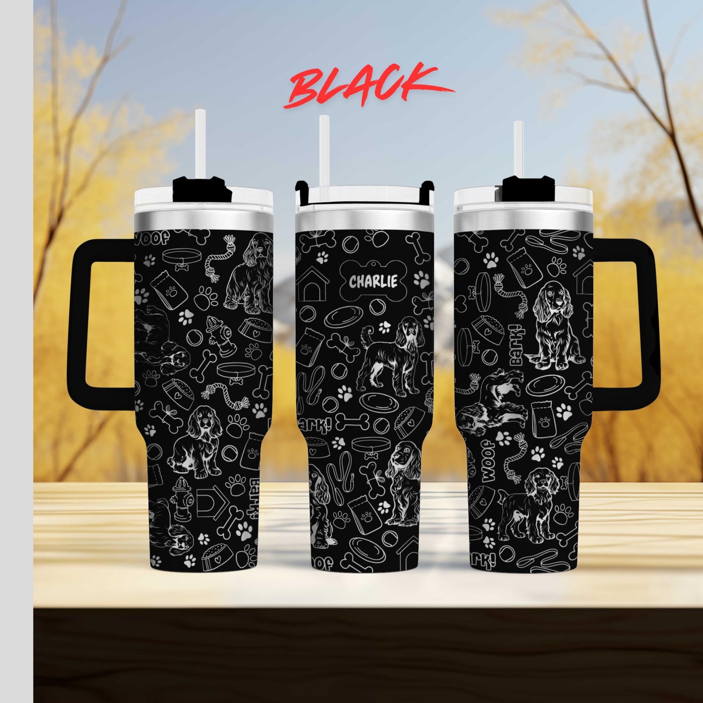 a couple of black coffee mugs sitting on top of a table