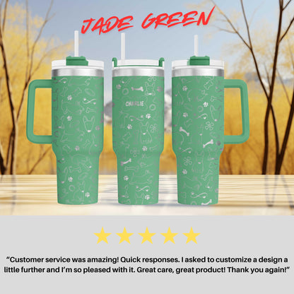 three green travel mugs sitting on top of a table