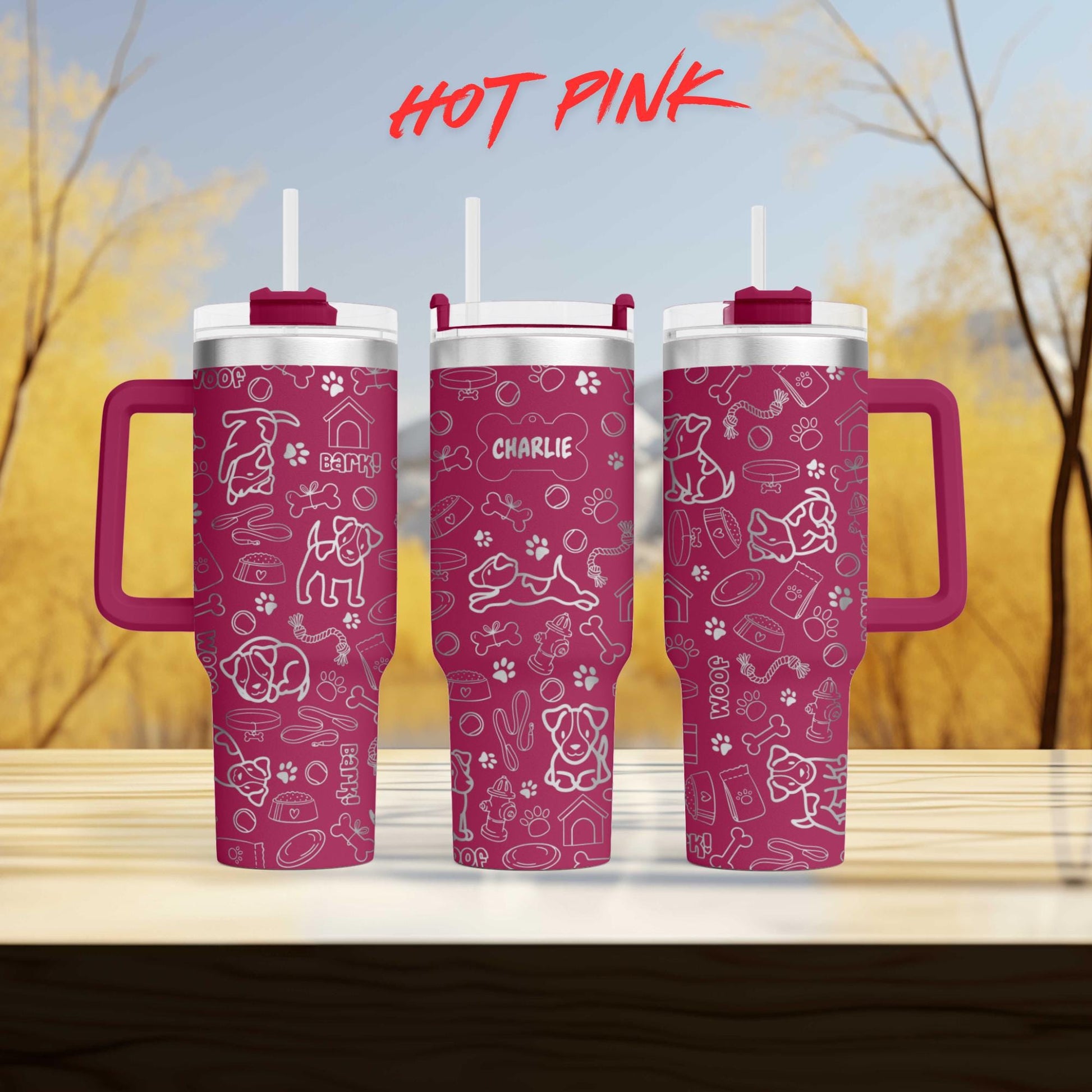 a couple of pink cups sitting on top of a wooden table
