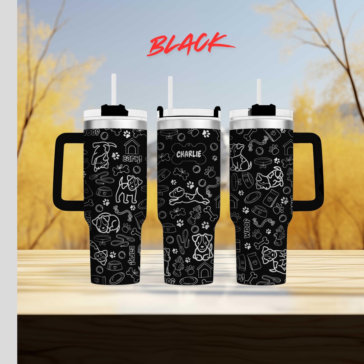 a couple of black cups sitting on top of a wooden table