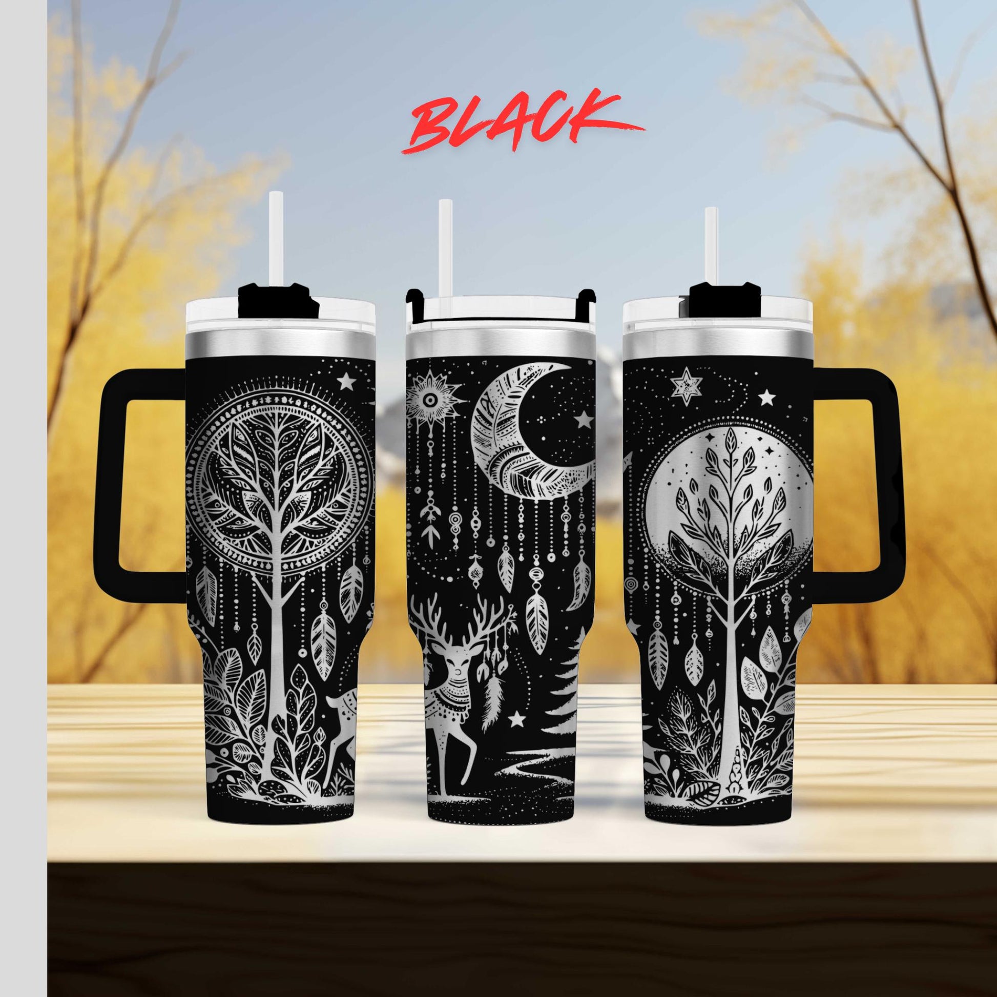 three travel mugs sitting on top of a wooden table
