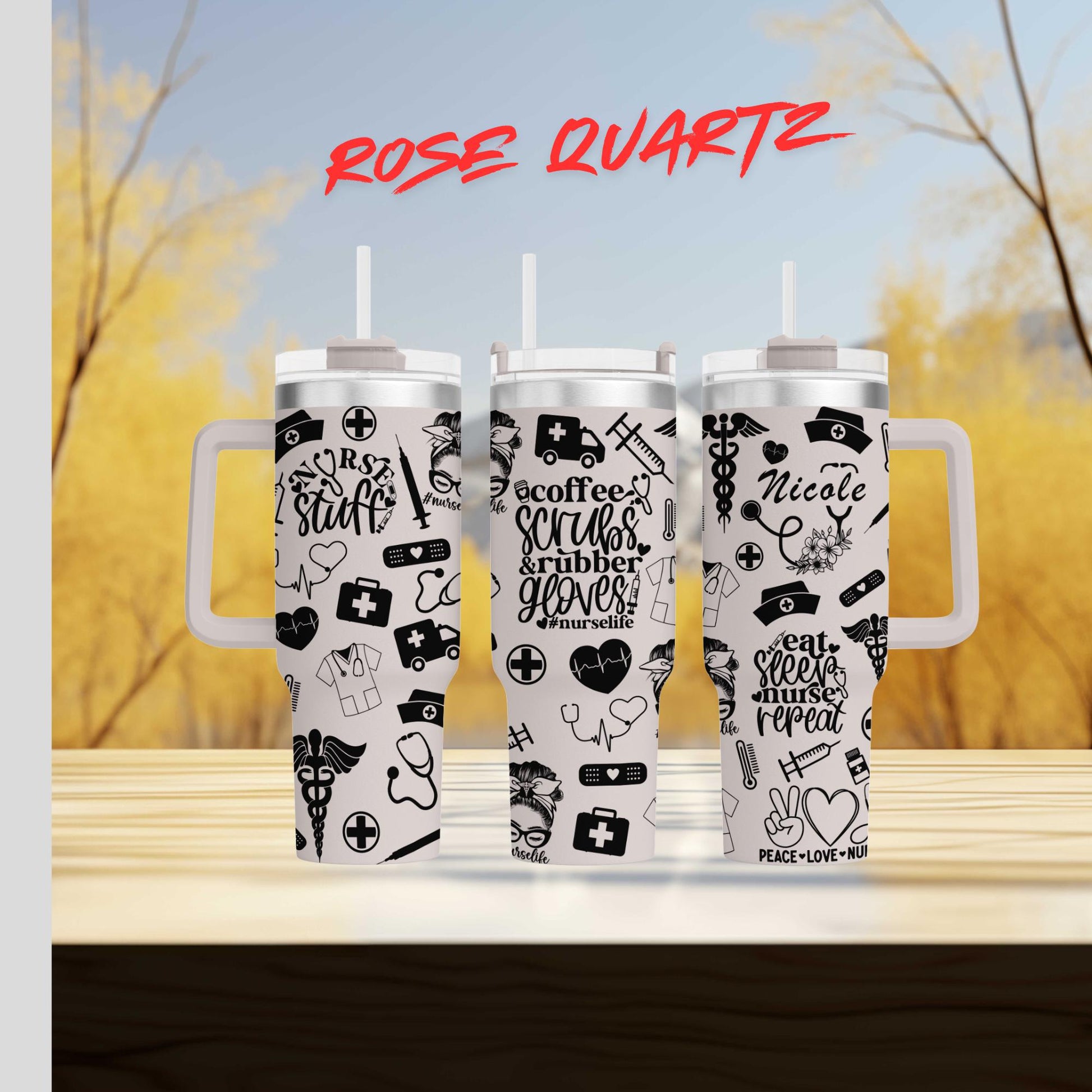 three travel mugs with stickers on them sitting on a table