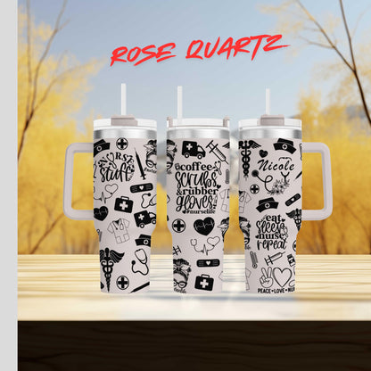 three travel mugs with stickers on them sitting on a table