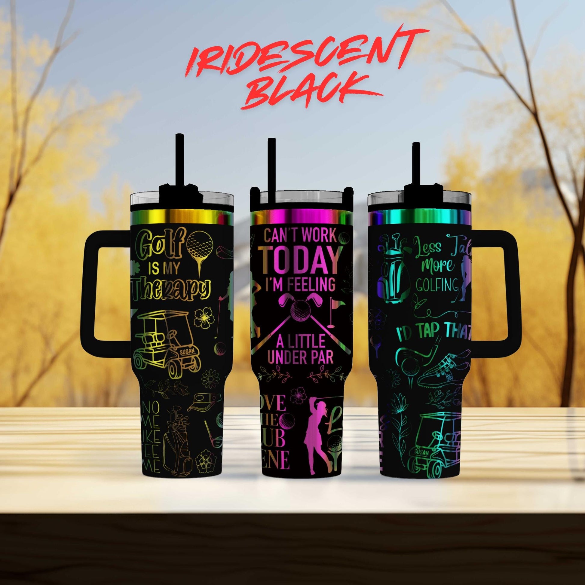 three travel mugs sitting on top of a table