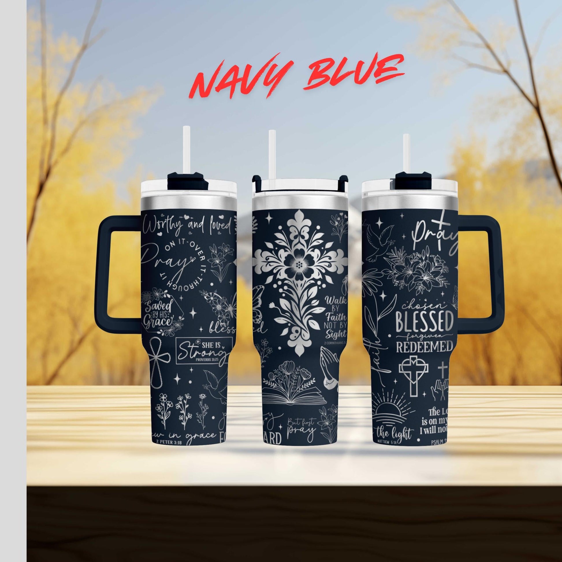 three travel mugs sitting on top of a wooden table