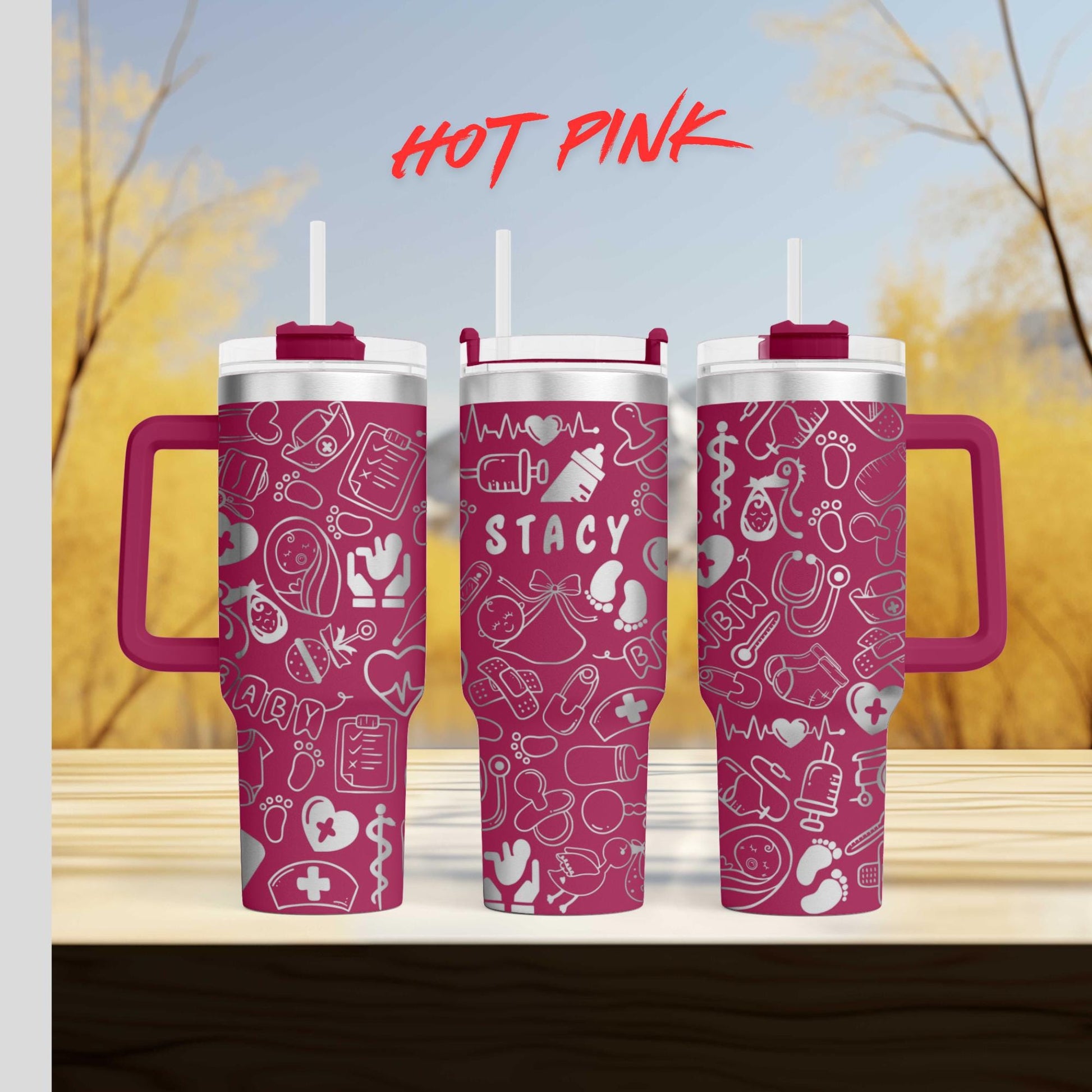 three pink travel mugs sitting on top of a wooden table