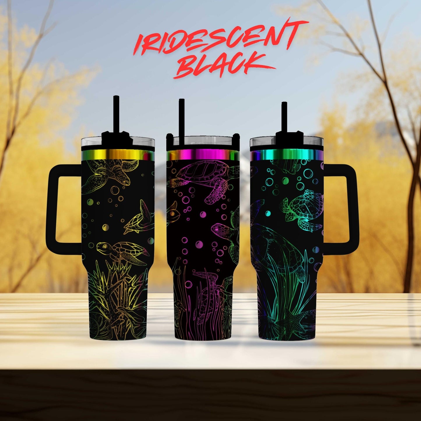 three different colored tumblers sitting on top of a table