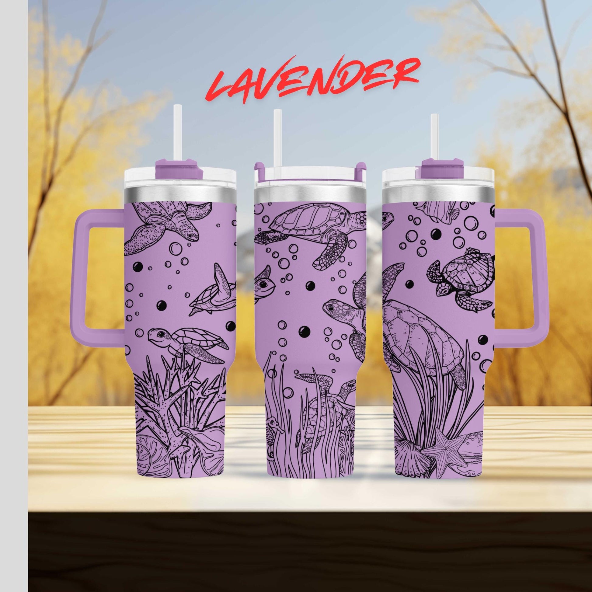 three travel mugs sitting on top of a wooden table