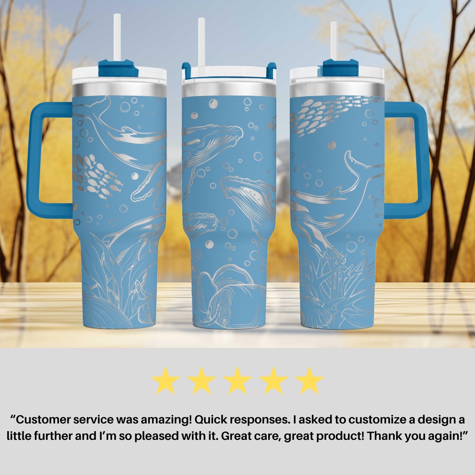 three blue travel mugs sitting on top of a table