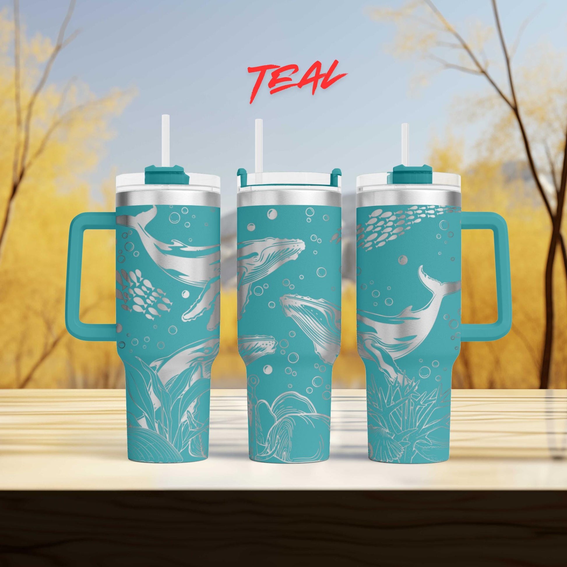 three teal colored cups sitting on top of a wooden table