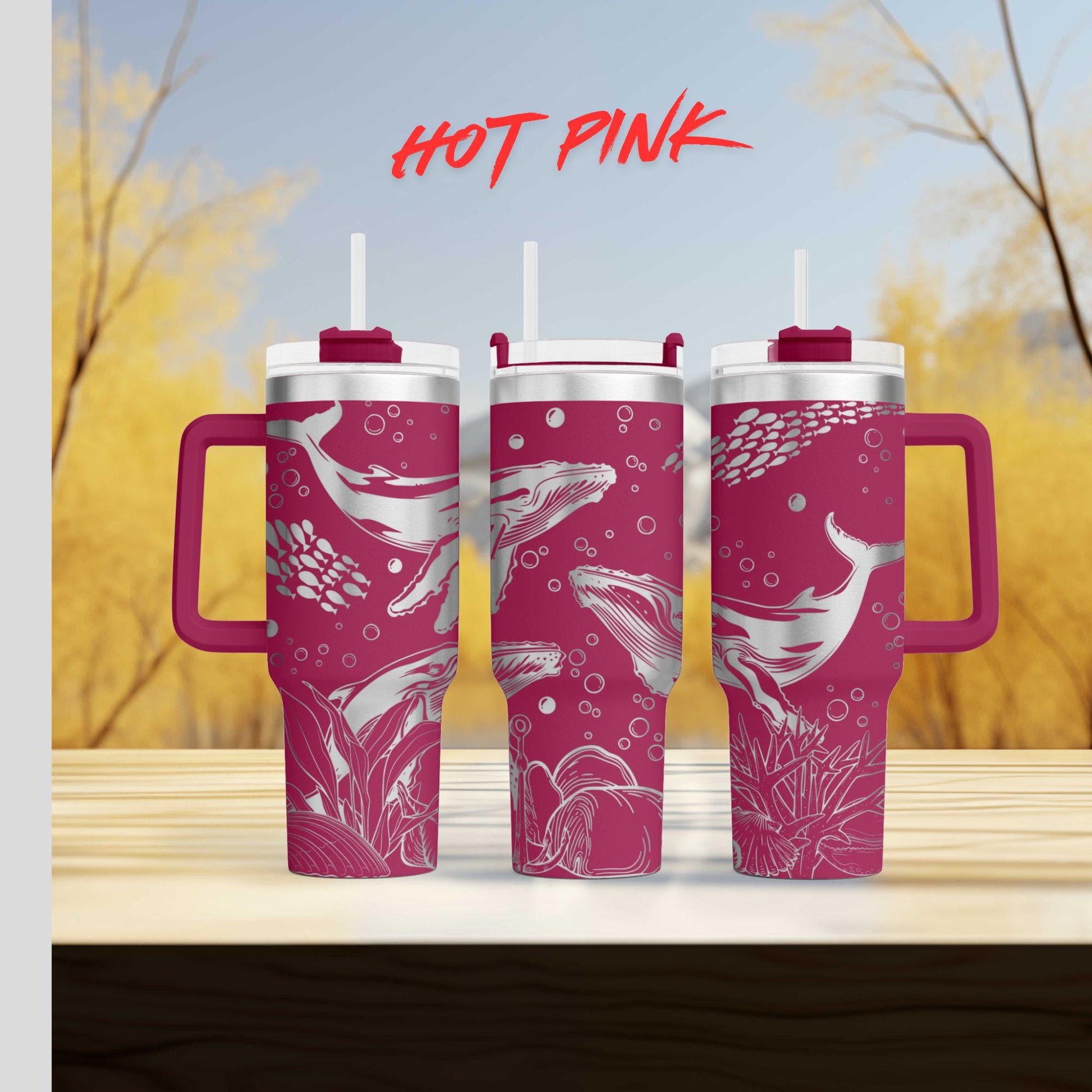 a couple of pink cups sitting on top of a wooden table