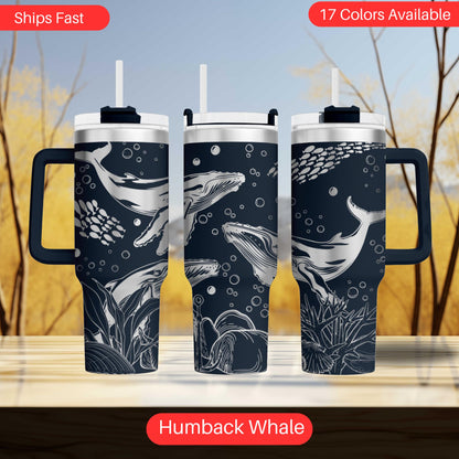 a set of three travel mugs with different designs on them