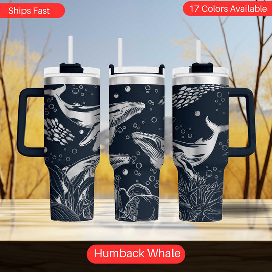 a set of three travel mugs with different designs on them