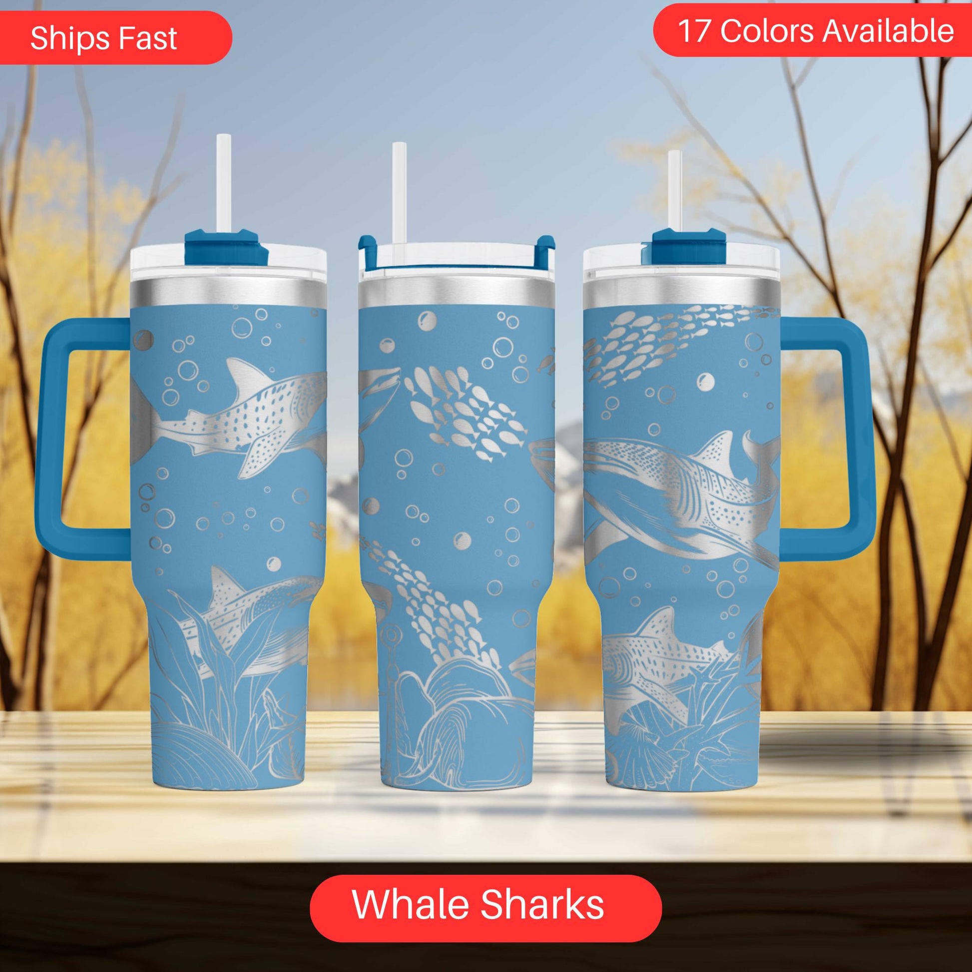 a set of three travel mugs sitting on top of a table