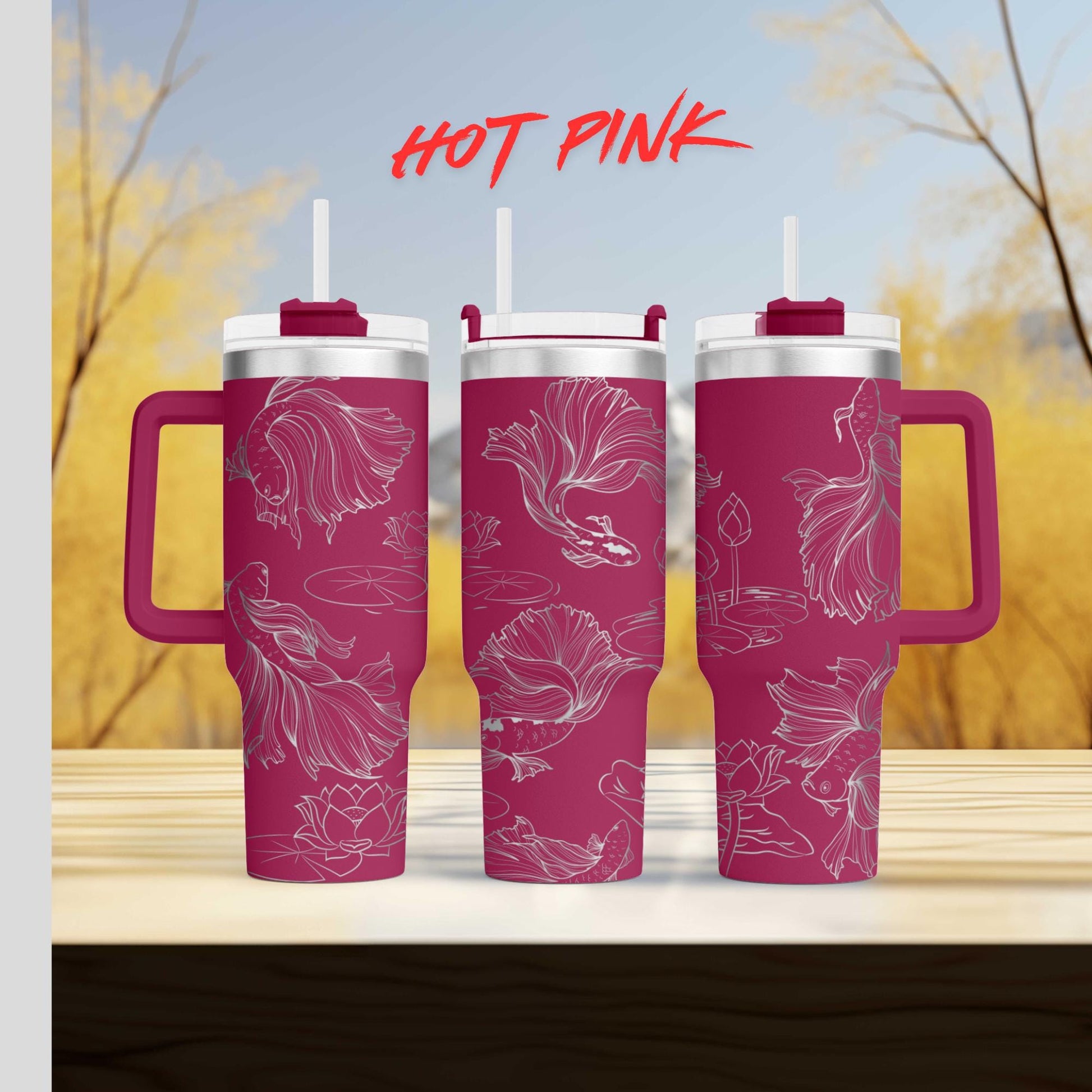 three pink coffee mugs sitting on top of a wooden table