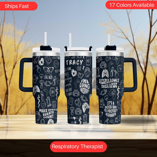 two travel mugs sitting next to each other on a table