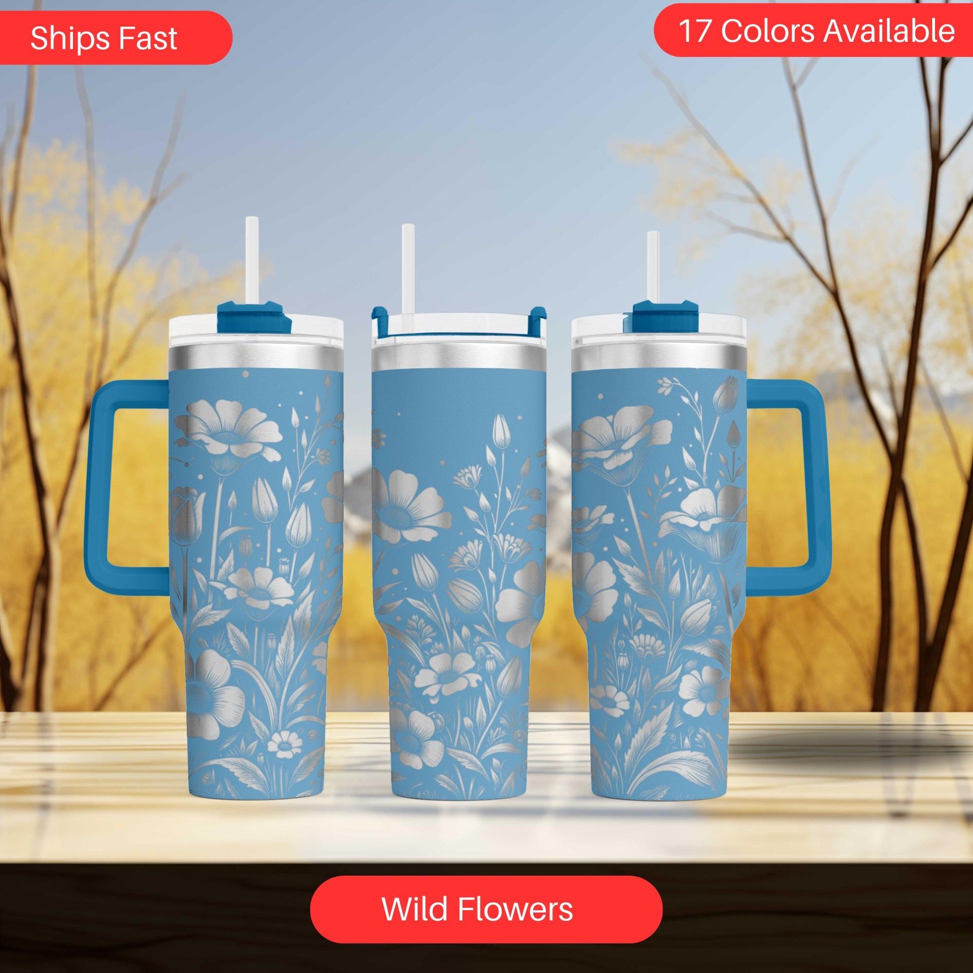 three travel mugs sitting on top of a table