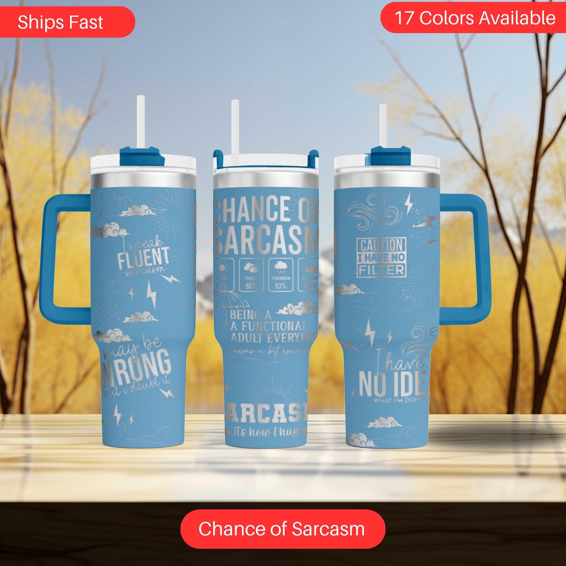 three travel mugs sitting on top of a table