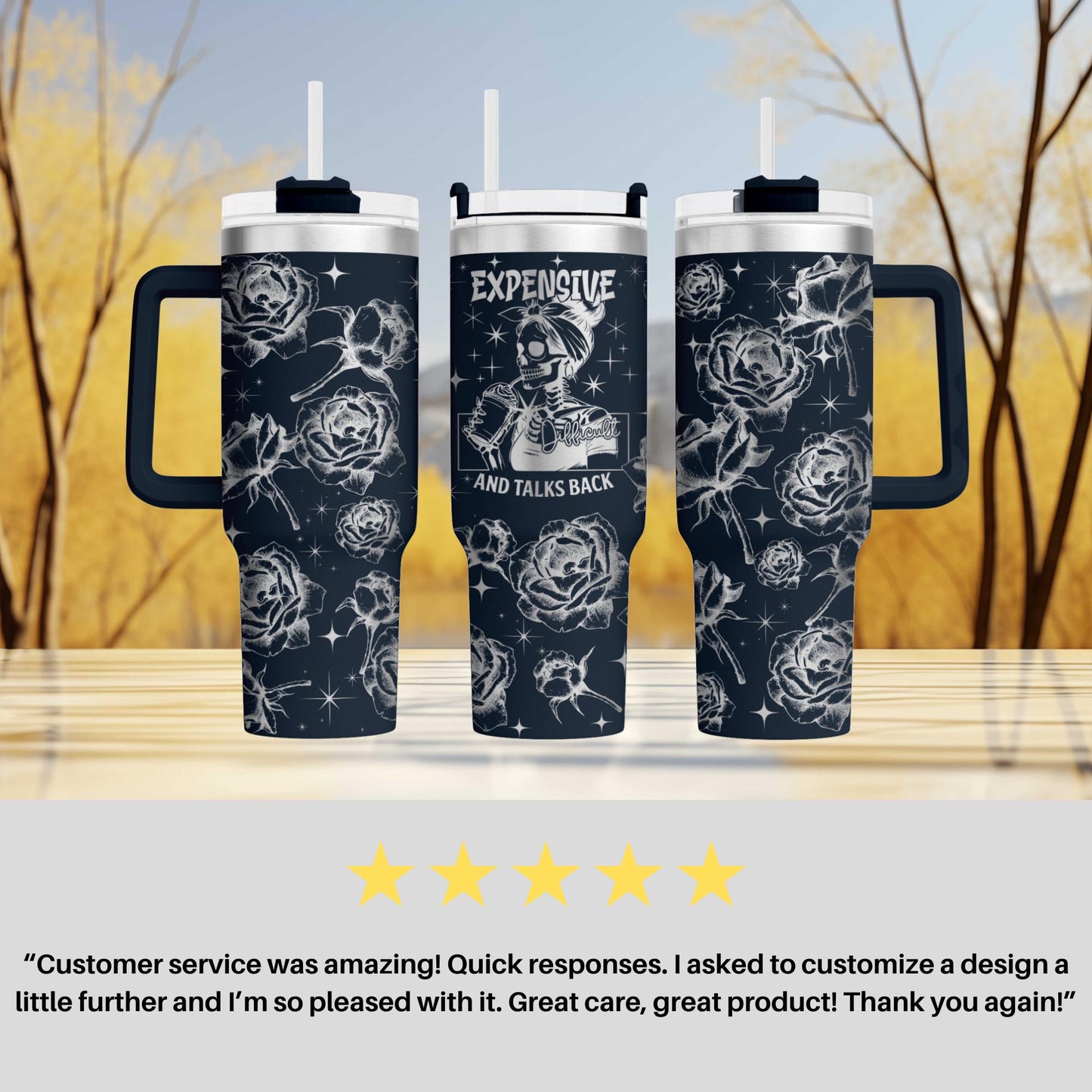 two travel mugs sitting on top of a table