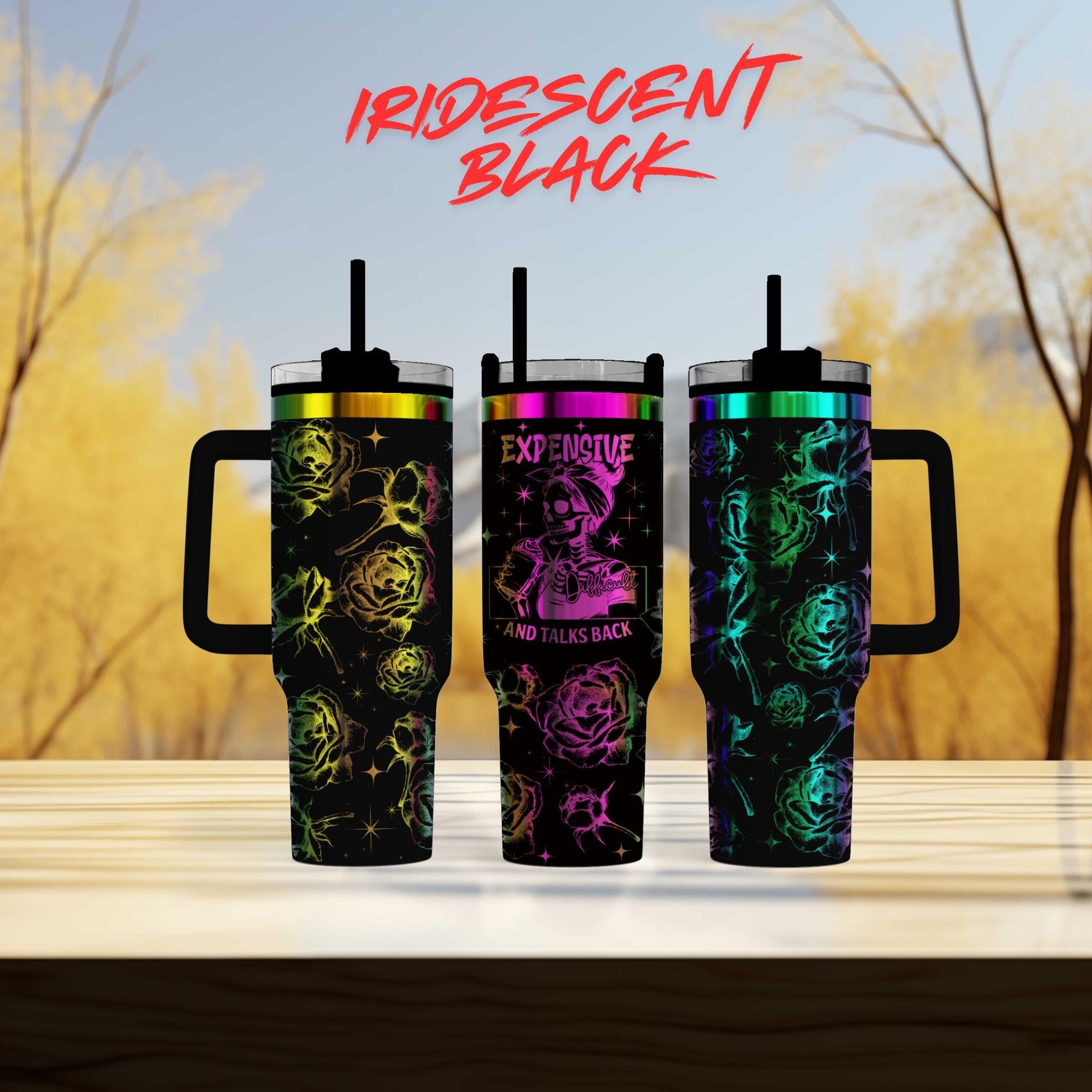 three different colored tumblers sitting on top of a table