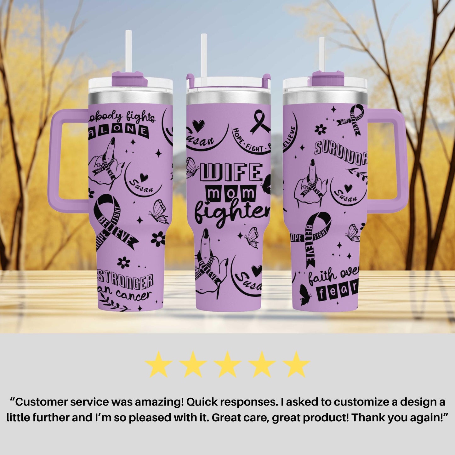 a set of three purple travel mugs sitting on top of a table