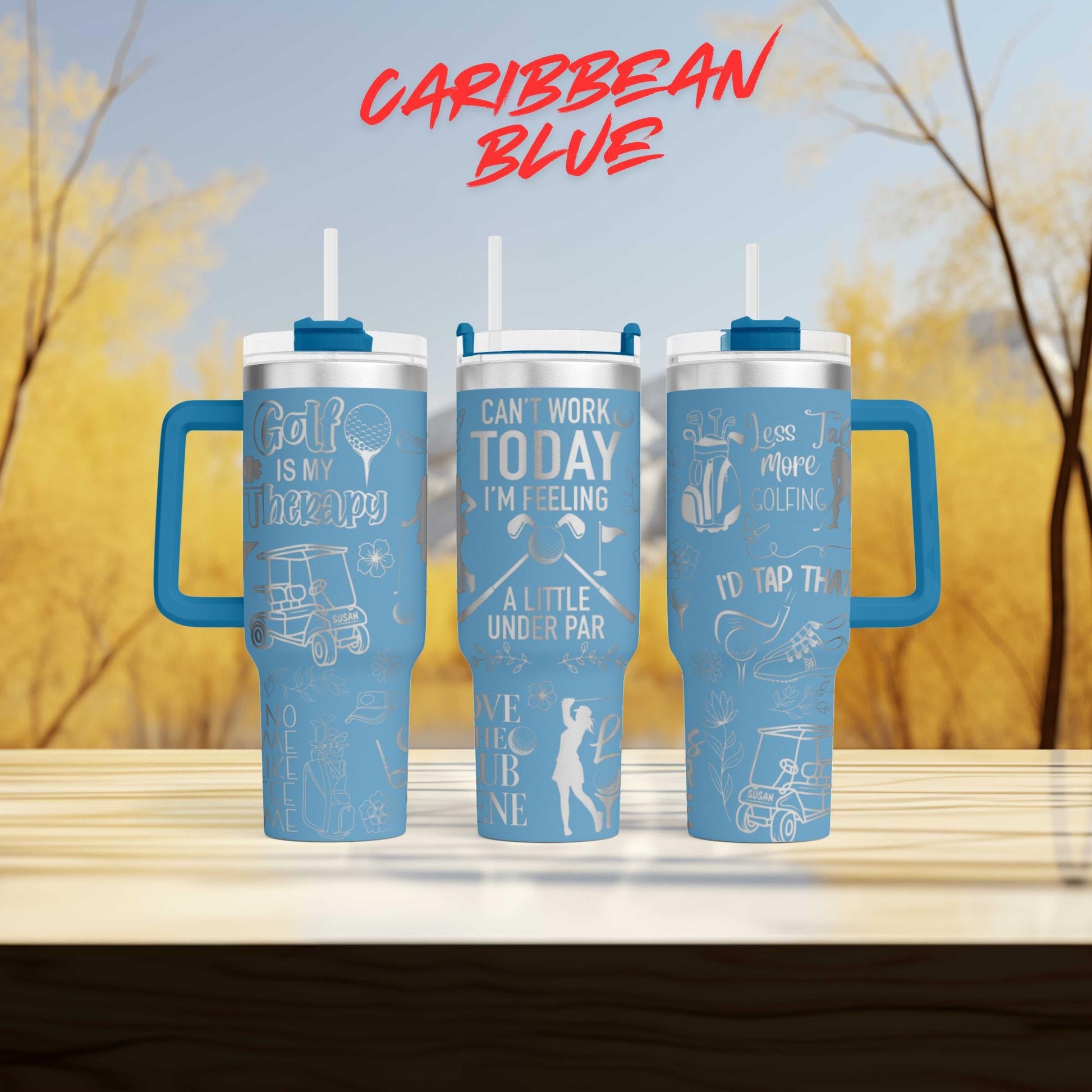 a couple of blue cups sitting on top of a wooden table