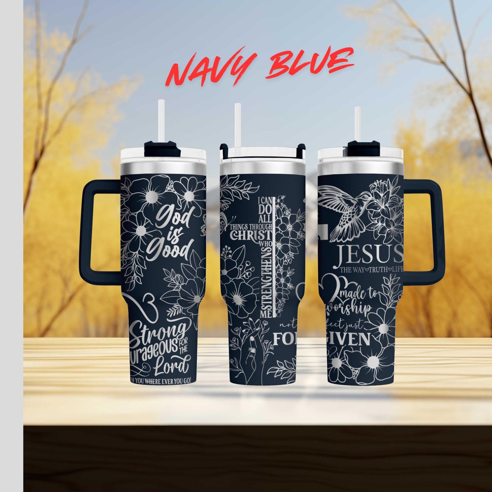 three travel mugs sitting on top of a wooden table