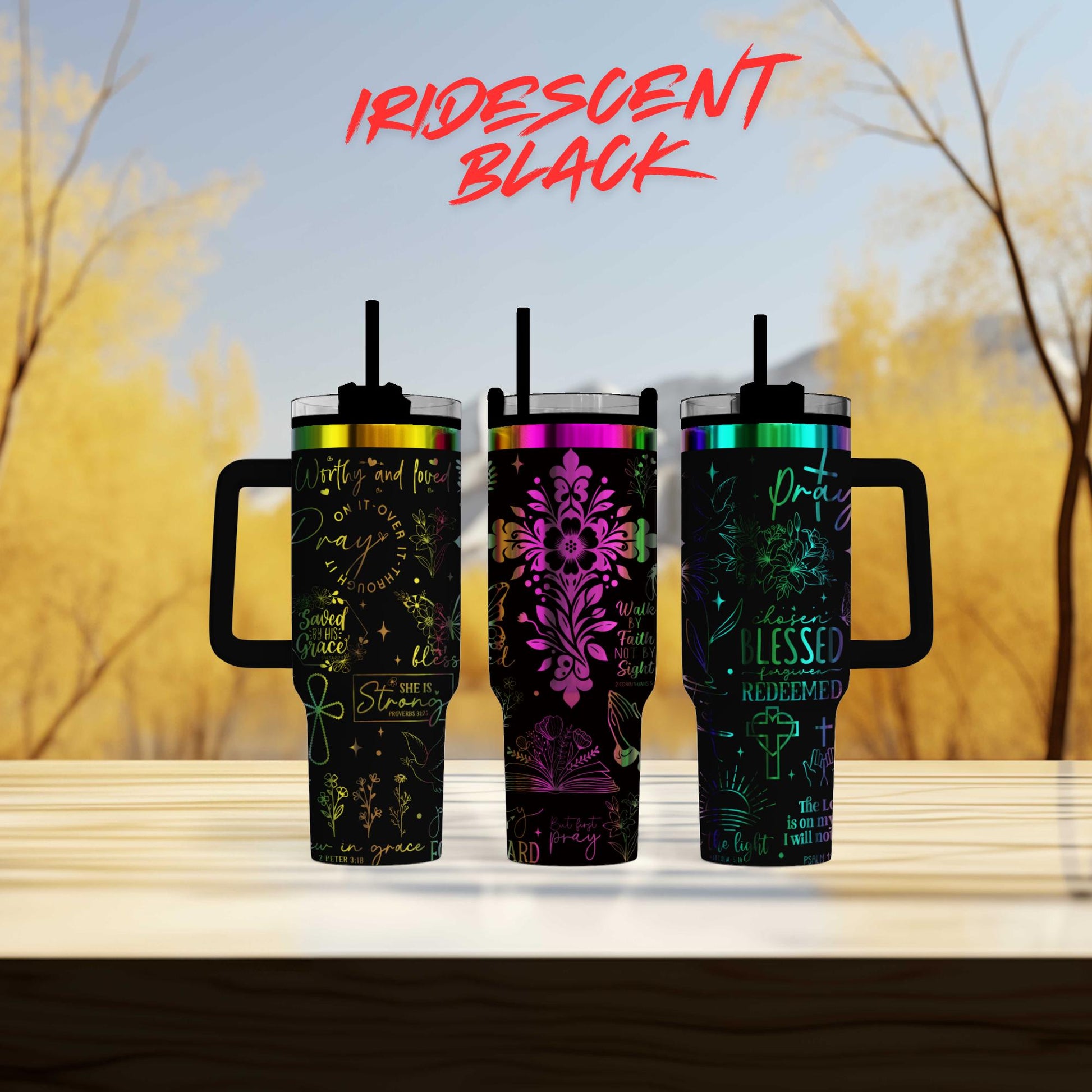 three colorful tumblers sitting on top of a wooden table