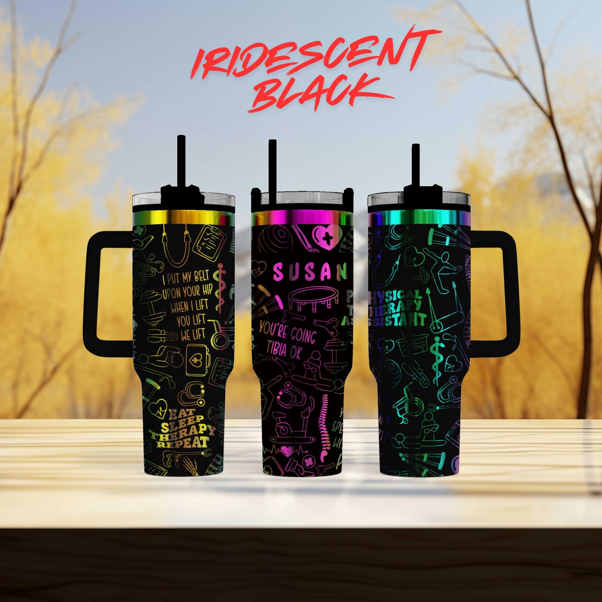 three different colored tumblers sitting on top of a table