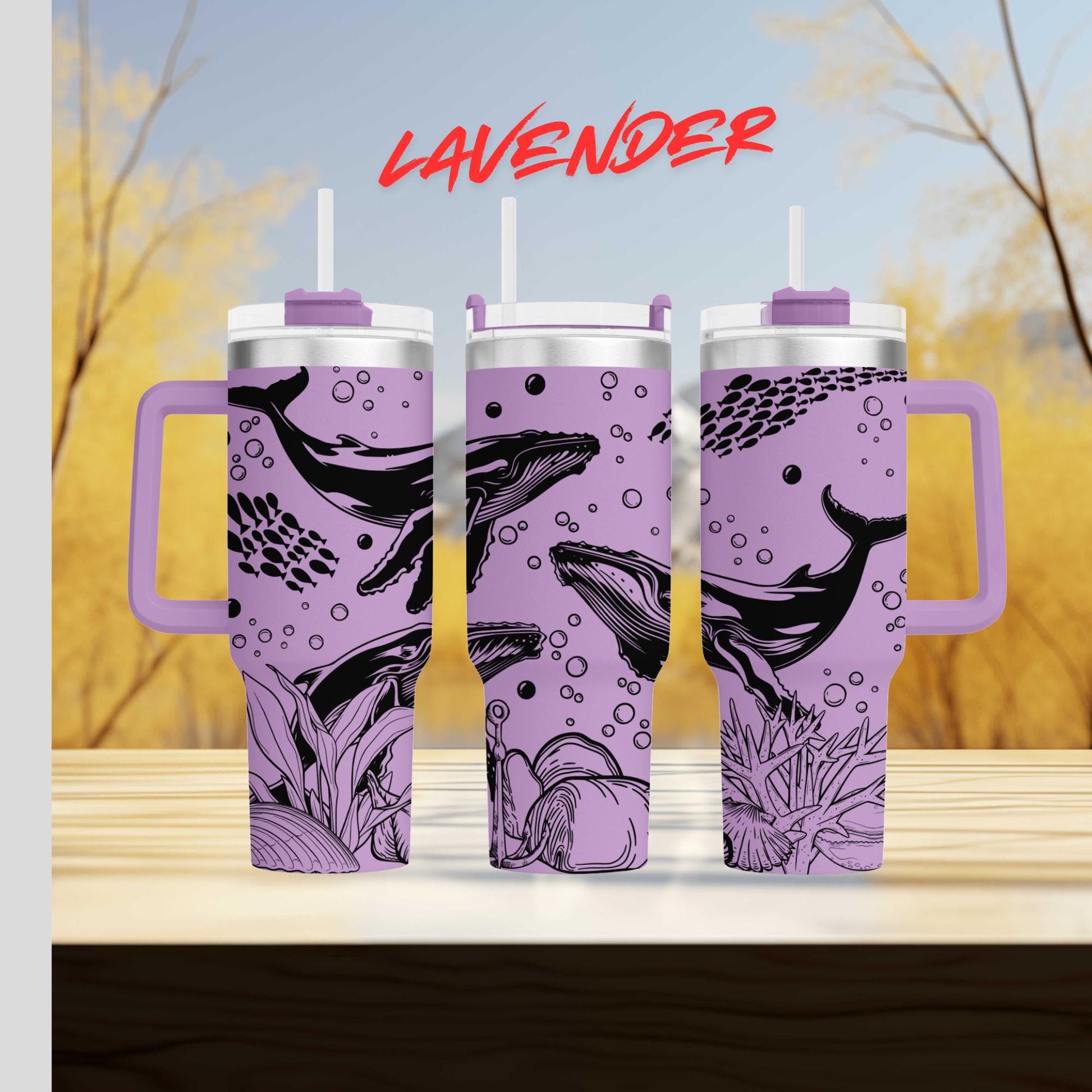 three travel mugs sitting on top of a wooden table