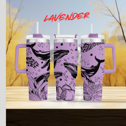 three travel mugs sitting on top of a wooden table