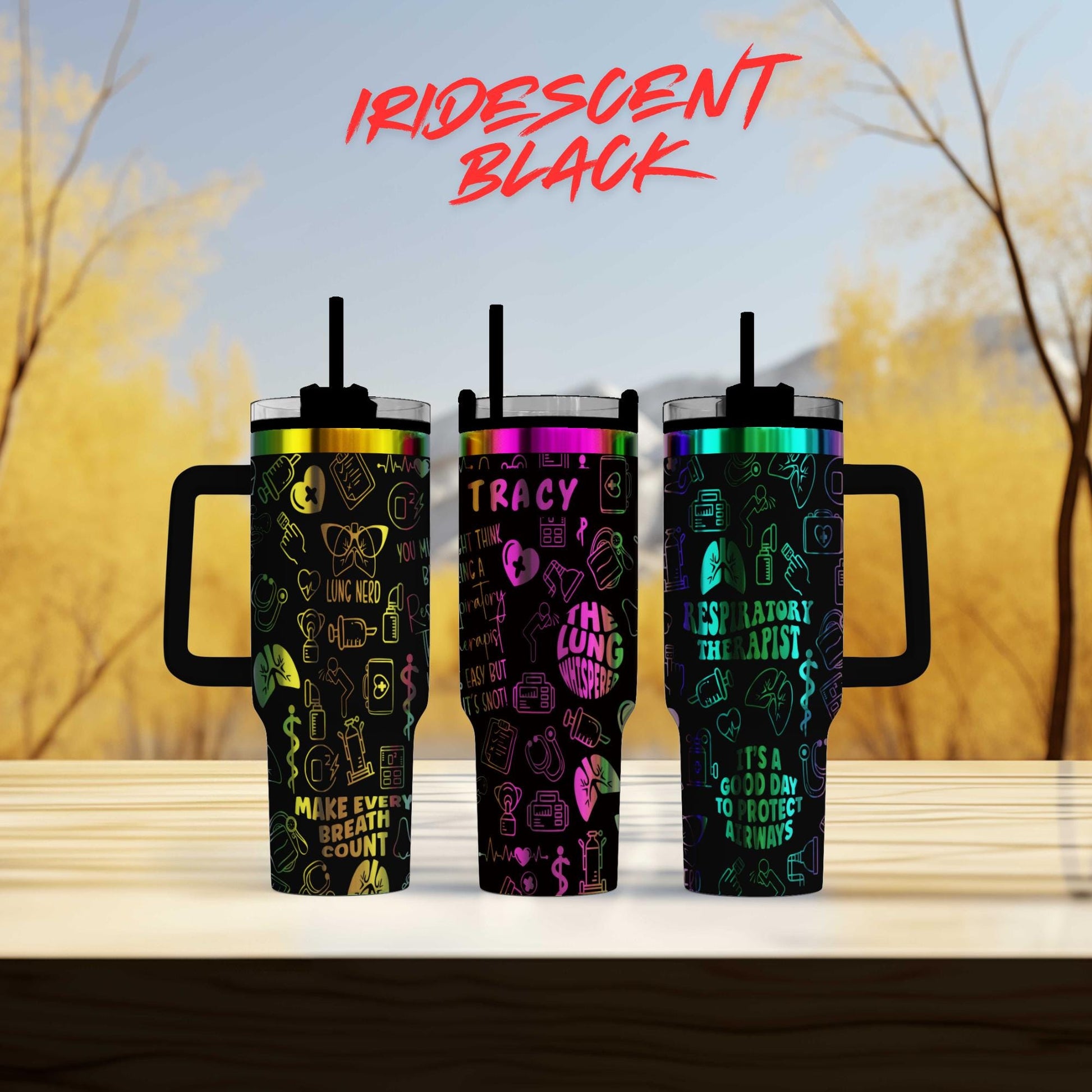 three different colored tumblers sitting on top of a table