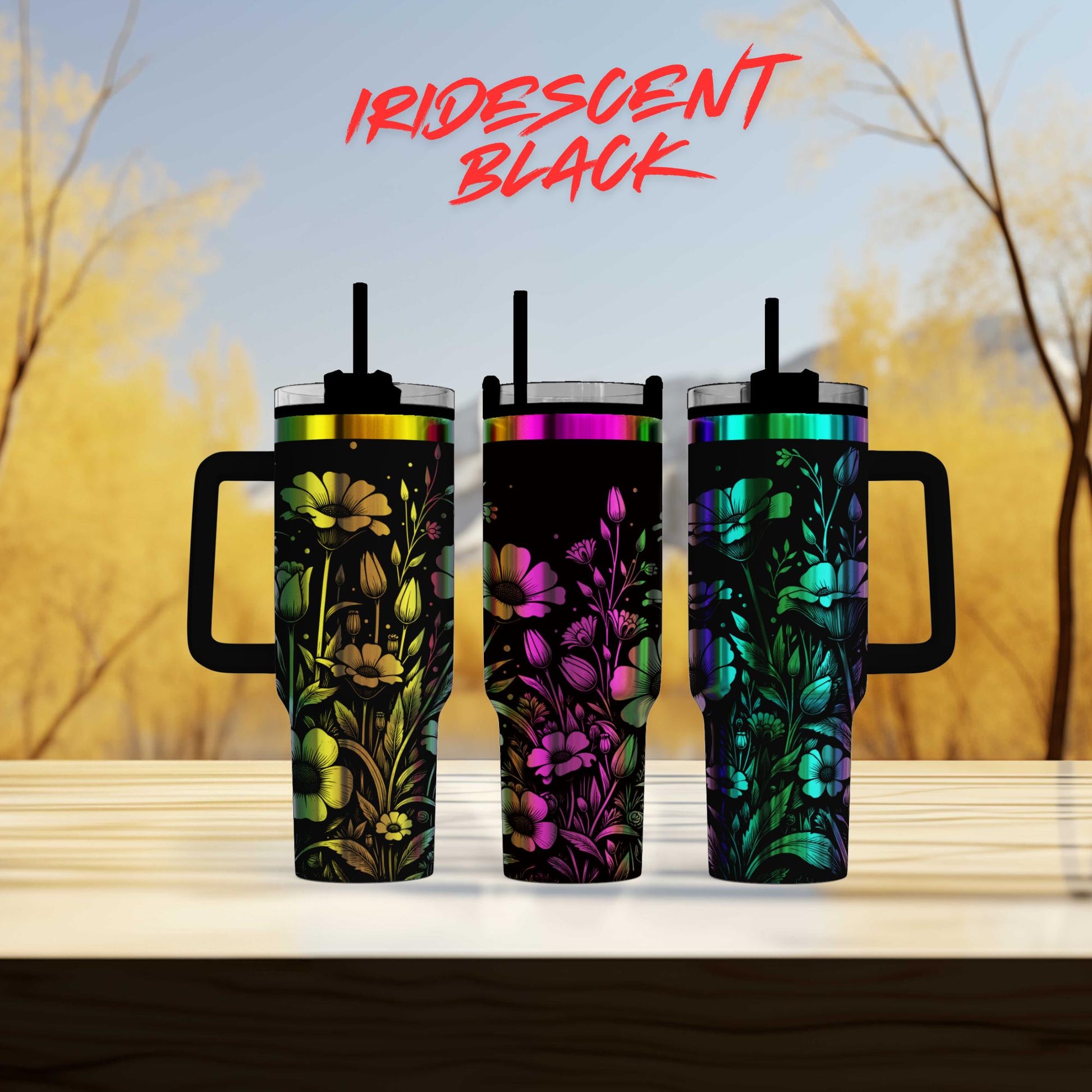 three colorful tumblers sitting on top of a wooden table
