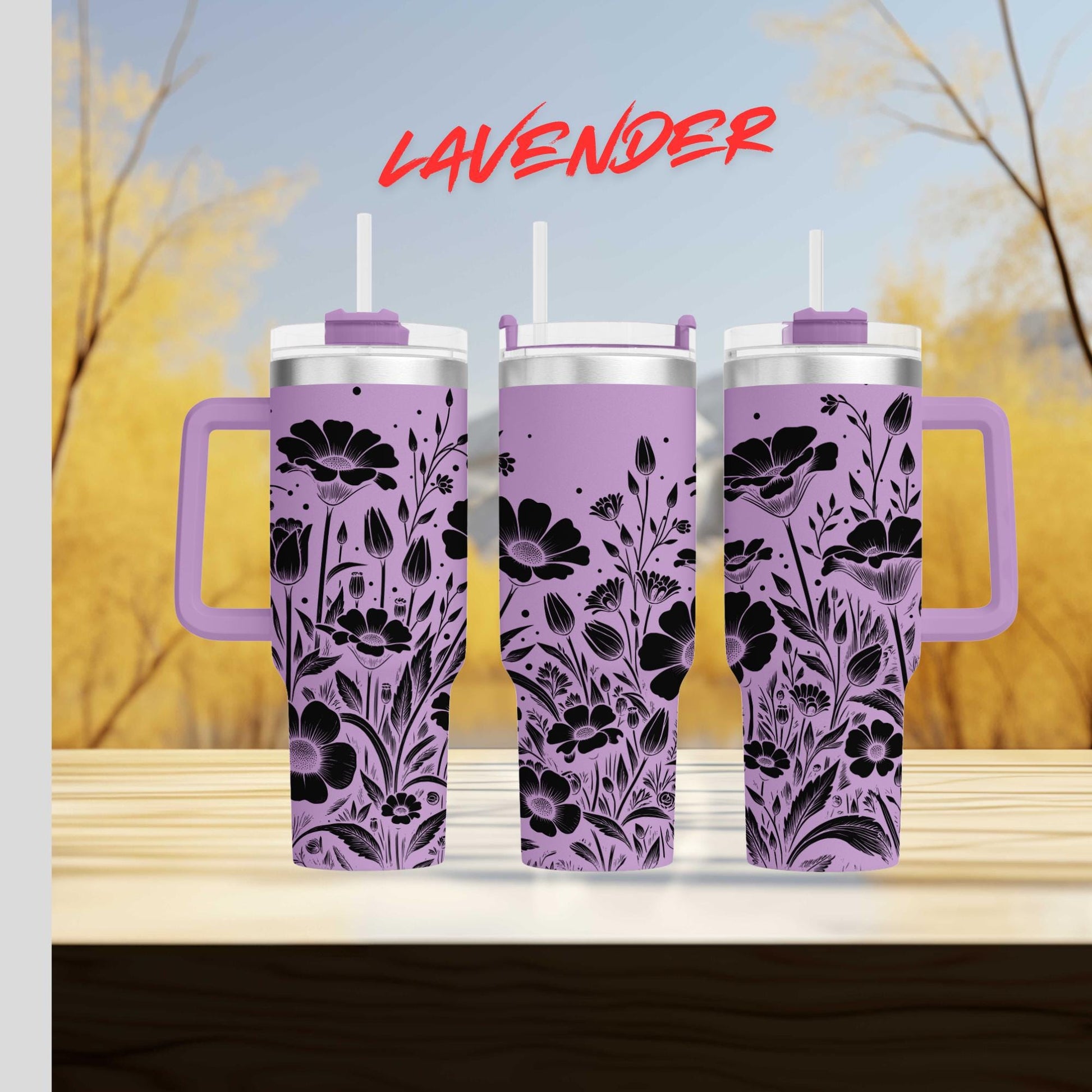 three travel mugs sitting on top of a wooden table