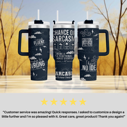 a couple of travel mugs sitting on top of a table