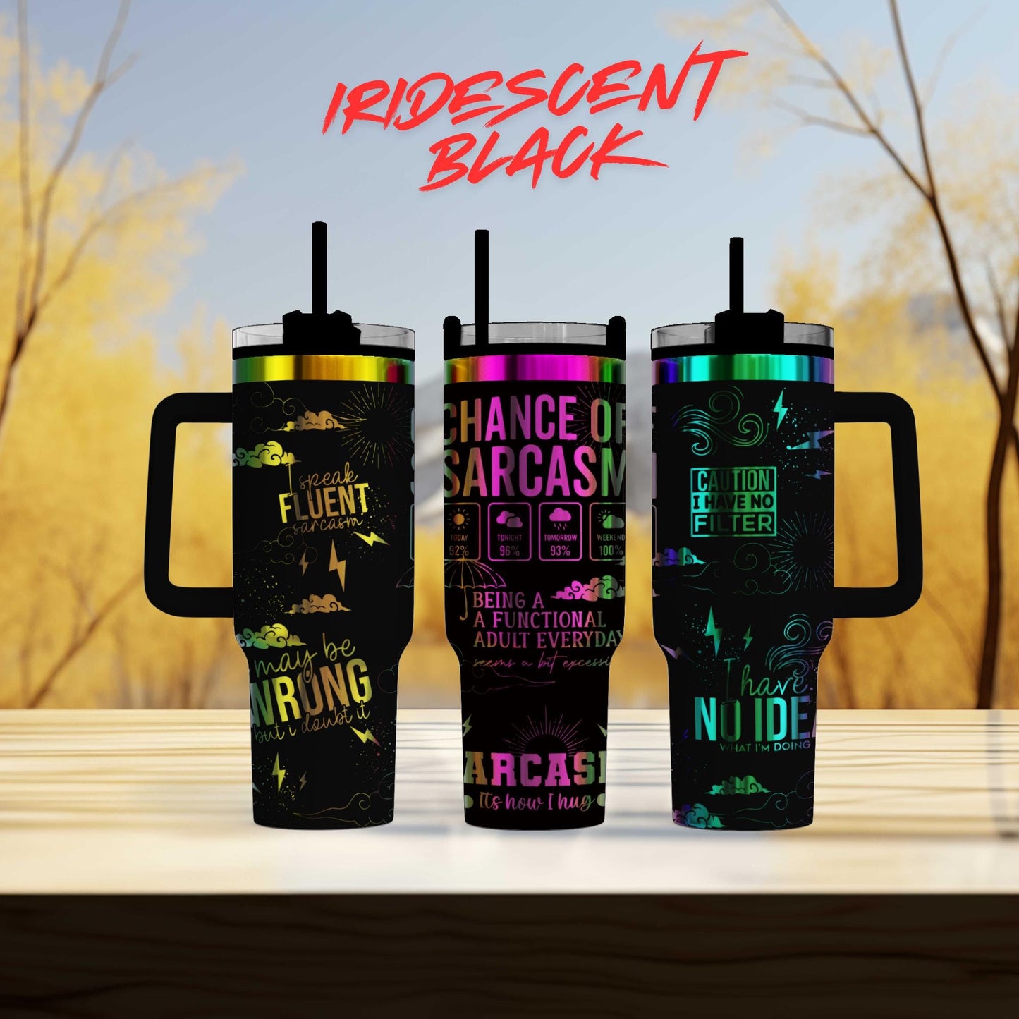 three travel mugs sitting on top of a table