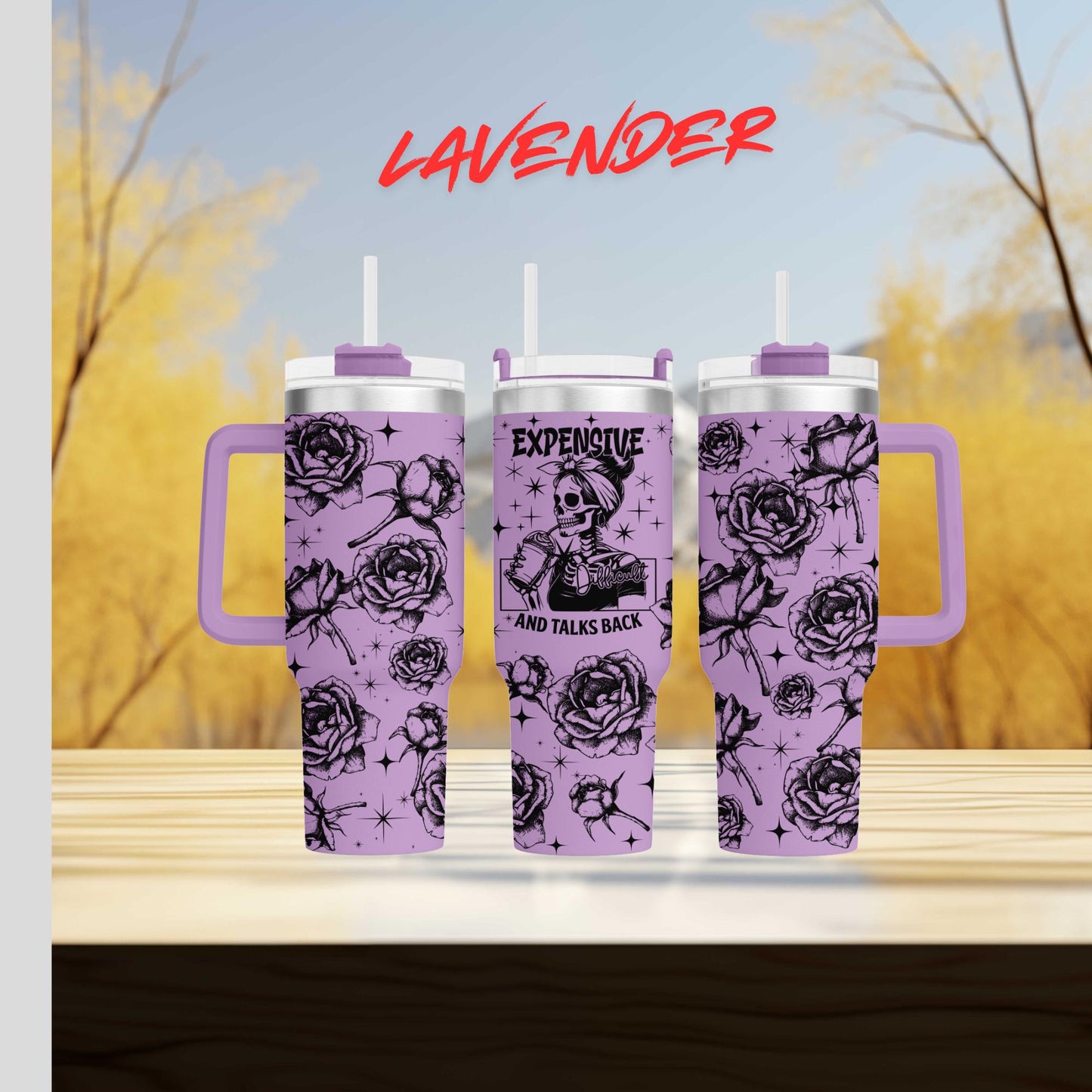 three travel mugs sitting on top of a wooden table