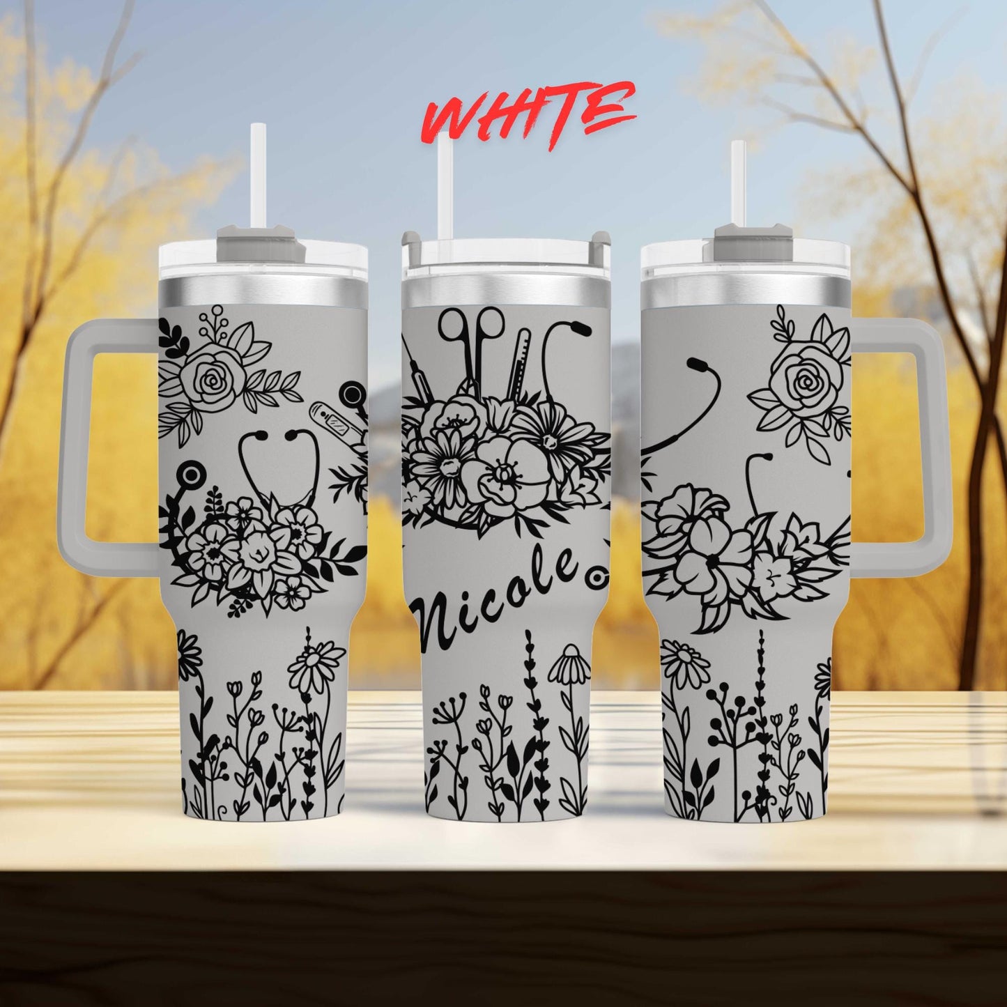 three white coffee mugs sitting on top of a wooden table