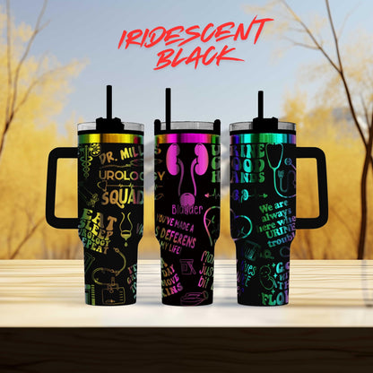 three different colored tumblers sitting on top of a table