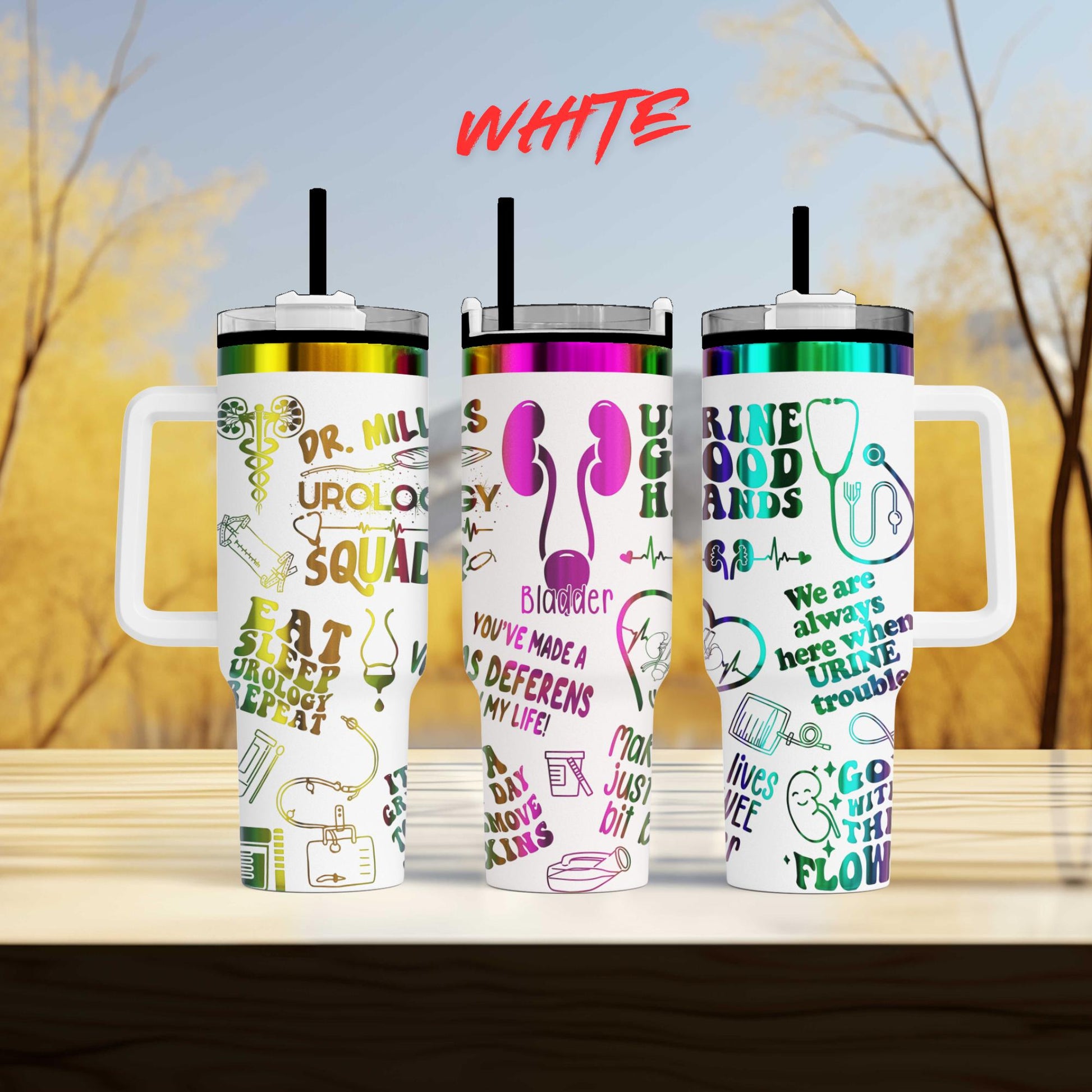 three different colored tumblers sitting on top of a table