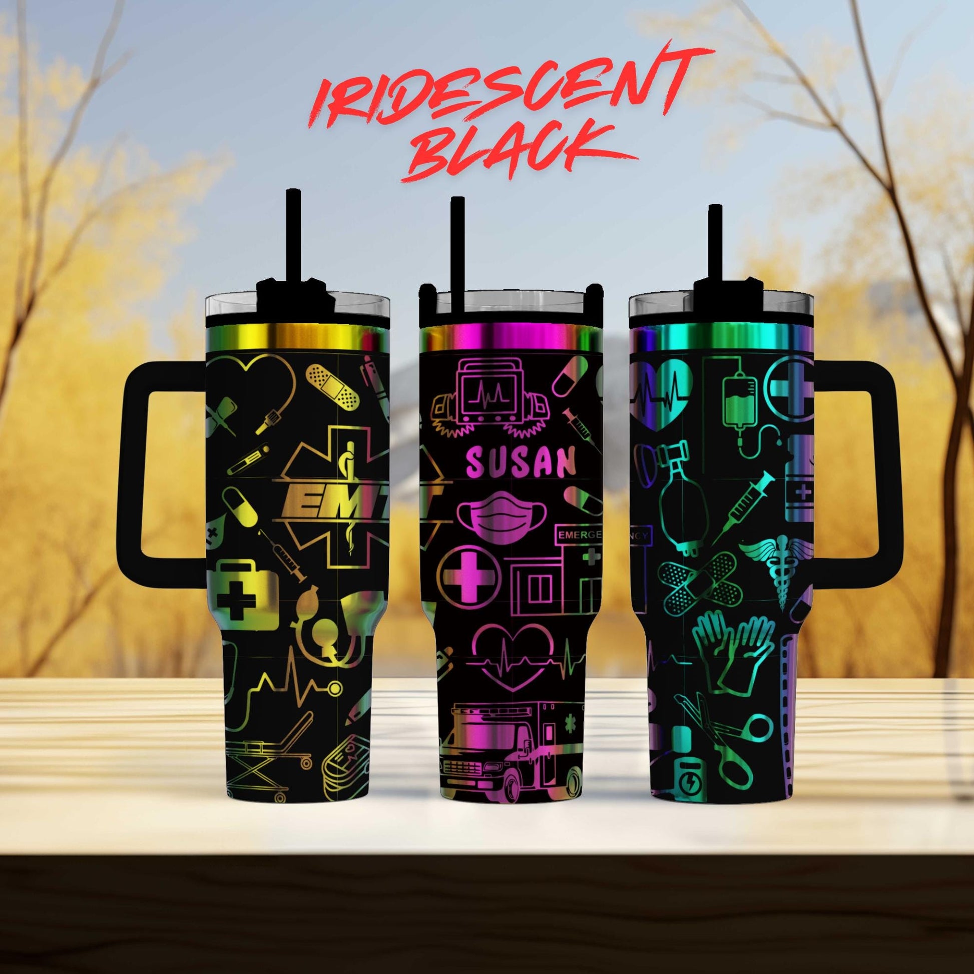 three different colored tumblers sitting on top of a table