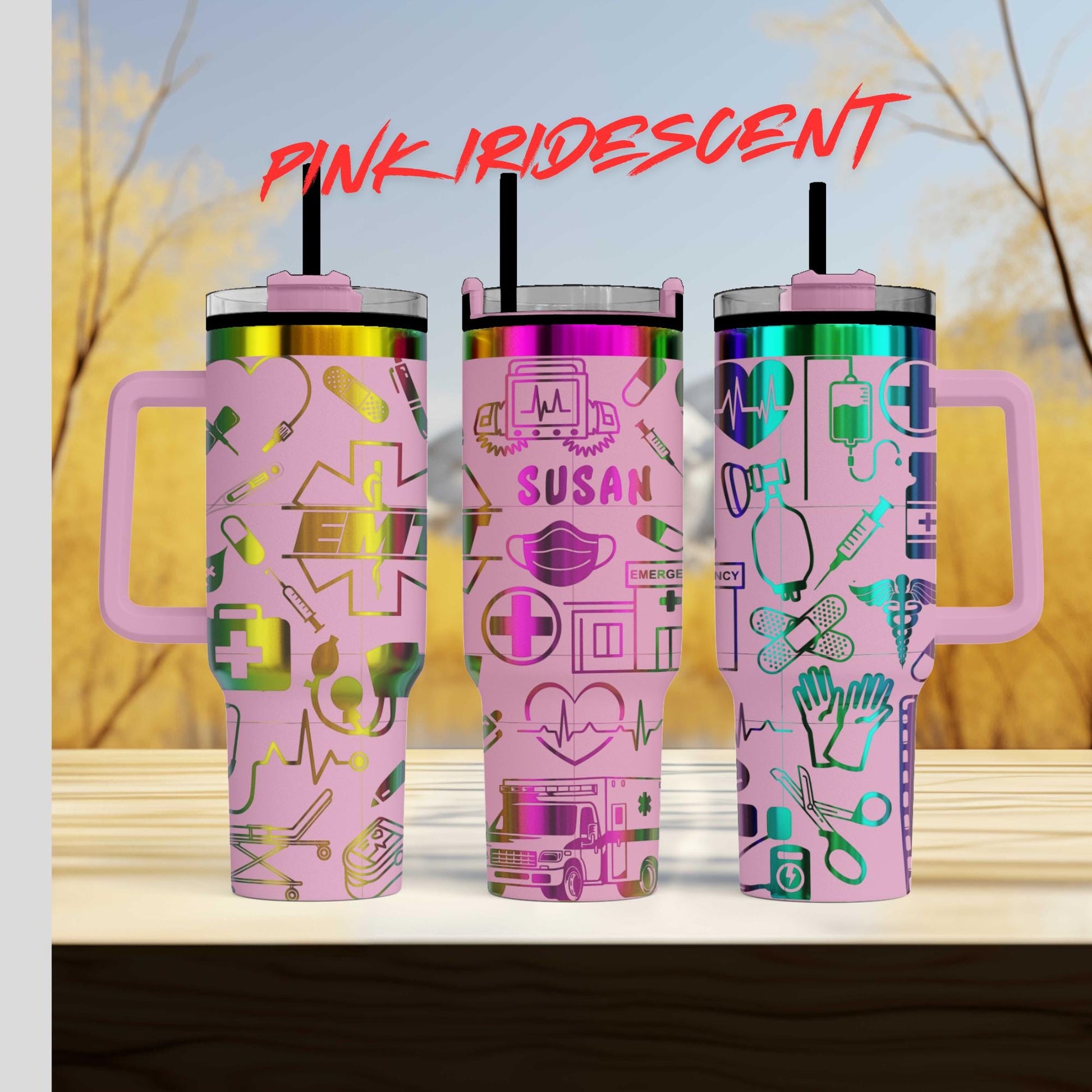 three pink travel mugs with different designs on them
