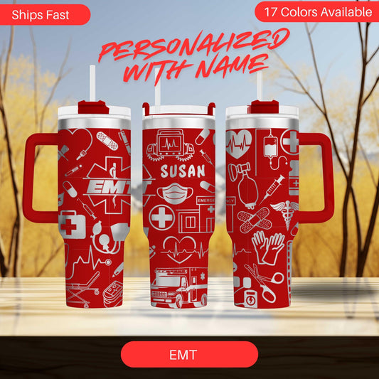 three red travel mugs sitting on top of a table