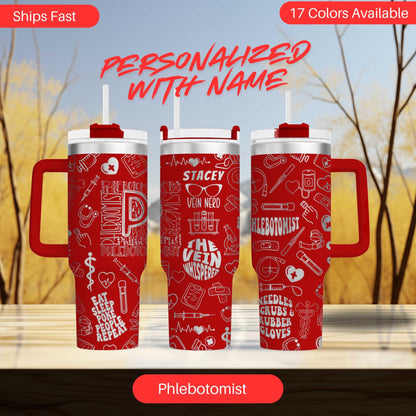 three red thermos tumblers with personalized names printed on them, set against a blurred background of trees.