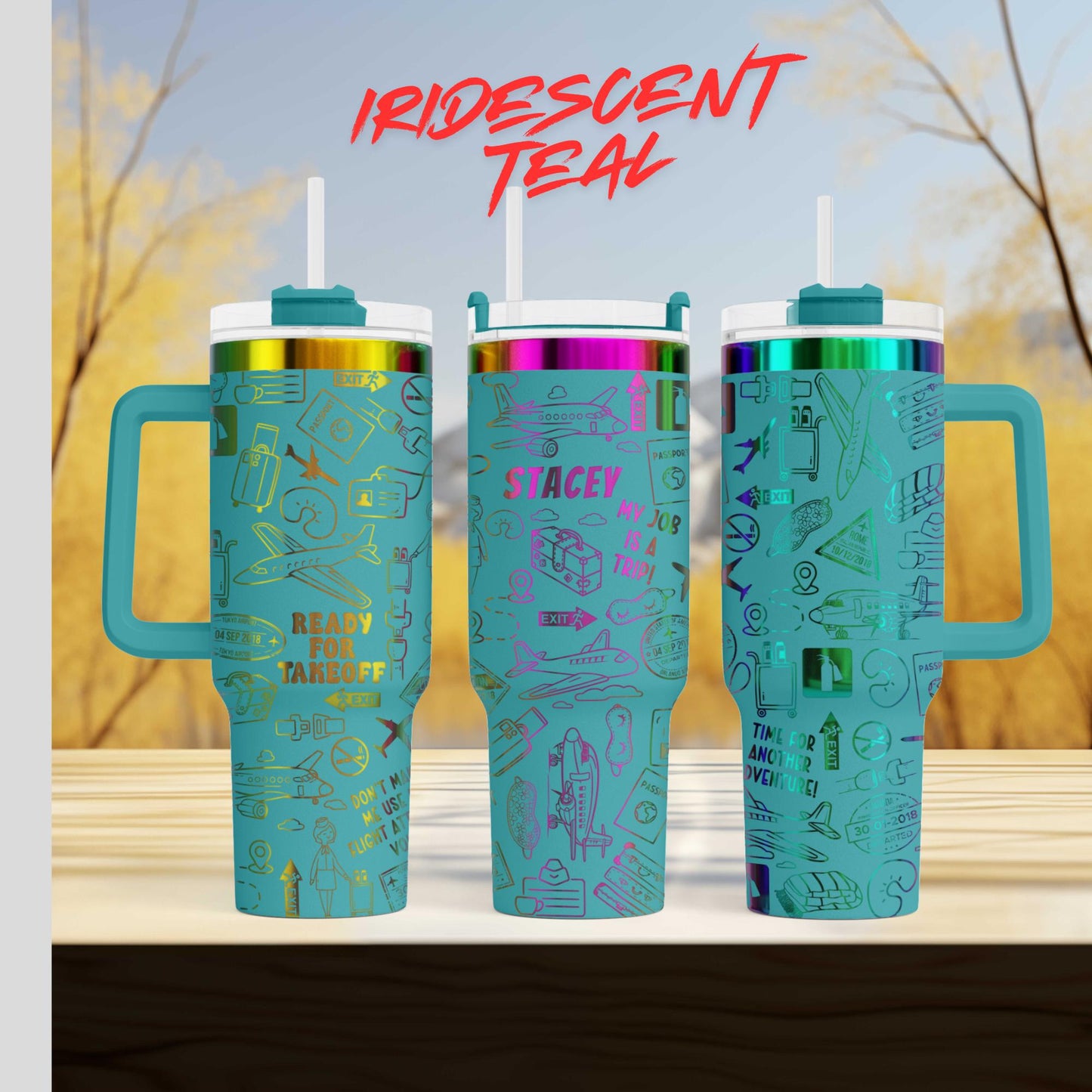 three turquoise tumblers with handles, each adorned with various designs and text. The text on the tumblers includes "IRIDEST TEAL", "SACLEY", and "MY JOB". The background of the image is a blurred outdoor scene with trees and a blue sky.