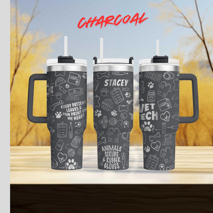 A black tumbler with a handle, featuring various veterinary-themed illustrations and text.