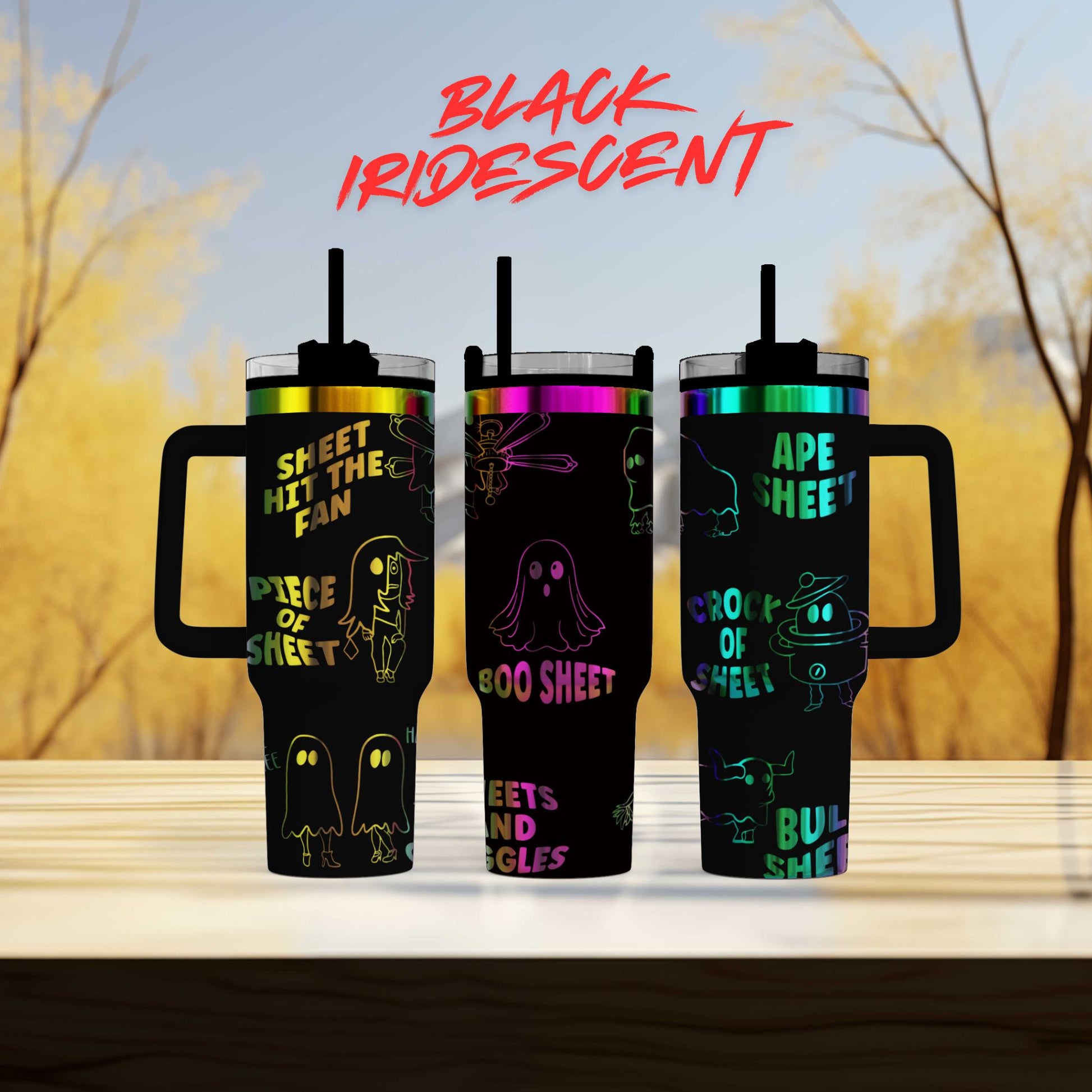 three colorful tumblers with ghost designs on them, set against a blurred background of trees.